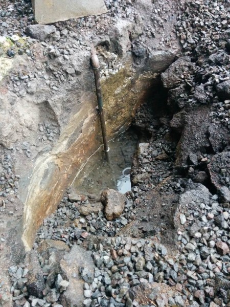 This is the mysterious waterpipe descending into the concrete-lined pit.