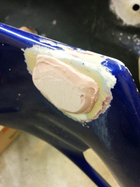 This blob of Bondo covers the plug made before, but  is added from the outside. 