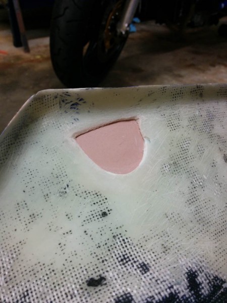 This is what was left after the inner blob of Bondo was popped off. The fiberglass can now be laid up against it and it will match the desired outer surface of the fairing.