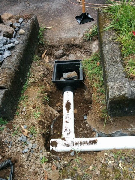 The catch basin by the driveway. There was solid rock all the way up where the catch basin is located, so a fair amount of demolition was needed to get it to fit.