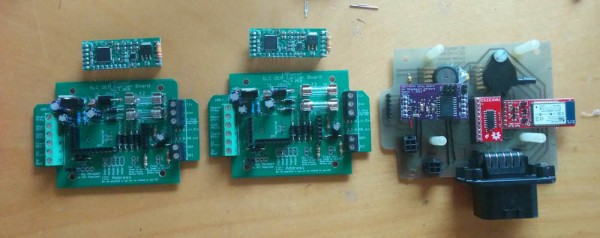 The two wideband oxygen sensor controller boards and my board, ready for stacking.
