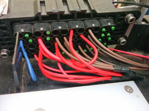 These are the main power distribution wires finally crimped together, heatshrinked, and plugged into the fusebox. 