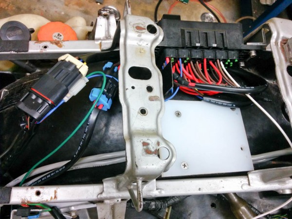 The stock fuse box has now been removed and those circuits connected to the appropriate fuses using the two Metri-Pack connectors on the left. The small 2-position connector connects the main relay to the ignition switch.