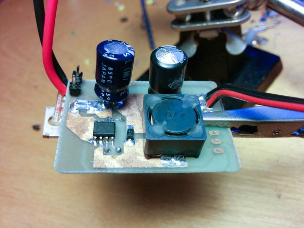 The ill-fated, repurposed buck controller board mounted on top of the LM317 sticking out to the left. Note the bulging top on the output capacitor on the right...