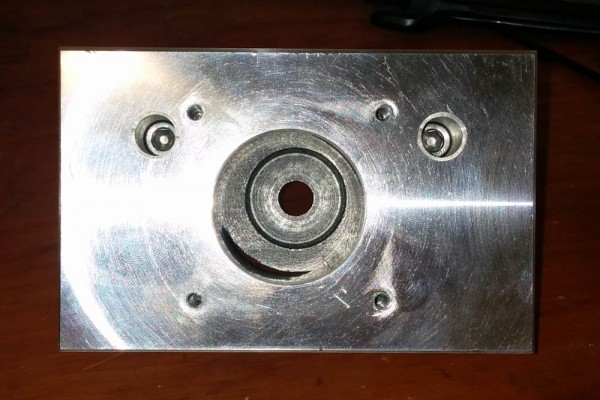 This is the view from the opposite end, down the ballscrew axis. It's obvious that the location of the thrust bearing in the back is not concentric with the stepper motor cutout in the front piece.