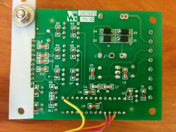 The back side of the spindle control board. The capacitor added to make the low-pass filter is marked "R2", right next to the jumper that connects the incoming PWM signal to the input capture pin.