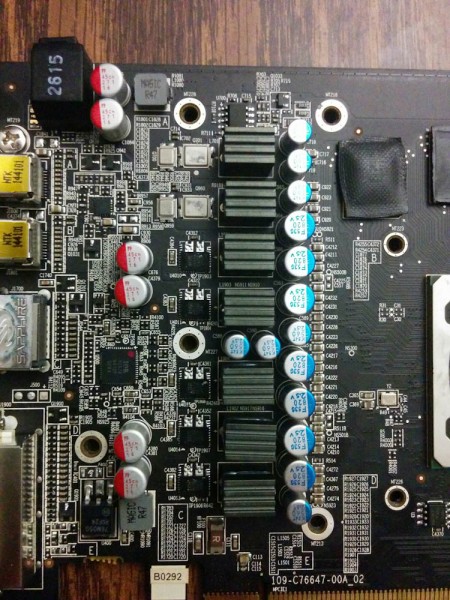 The vertical row of small ICs are the voltage regulators. The large shunt resistors to the right of them were also cooled by the factory fan.