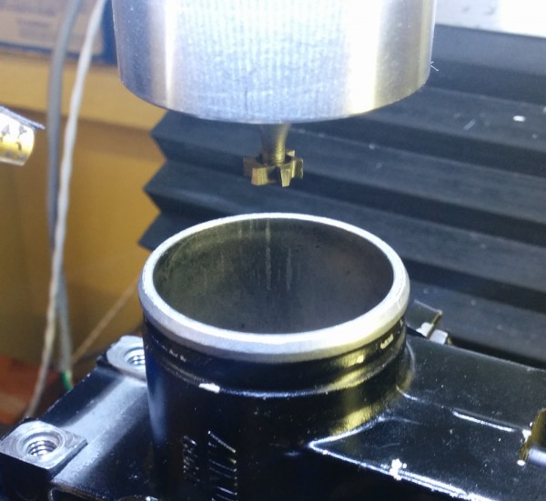 The mill is zeroed on the throttle body bore and we are ready to go. Since I want to leave positive ridges on the part, i can't cut with a normal endmill, so I used the key seat cutter instead.