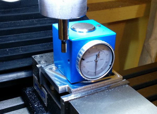 This is the Z-axis setter. When the button on top is depressed so the dial is at zero, it is exactly 50mm above the base.