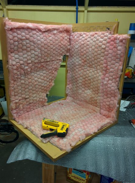 To absorb the sound coming from the compressor before it can get out of the box, I mounted fiberglass on the inside. It's held in place with chicken wire stapled to the MDF box.